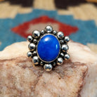 Sterling silver ring with lapis set in the round bezel, framed by dotted accents.