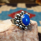 Sterling silver ring with lapis set in the round bezel, framed by dotted accents.
