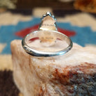 Sterling silver ring with lapis set in the teardrop bezel, framed by dotted accents.