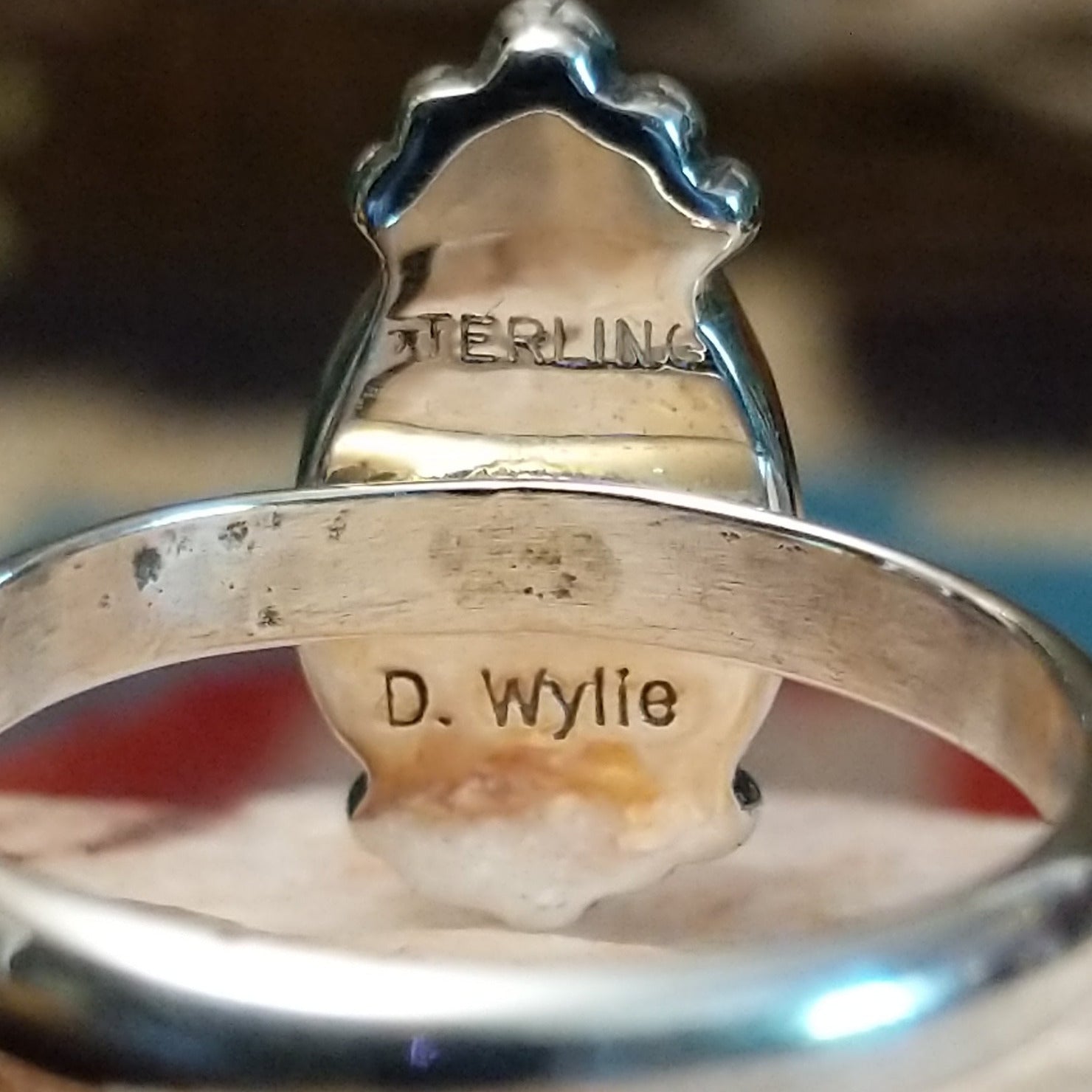 Close-up of the artisan's stamped signature.