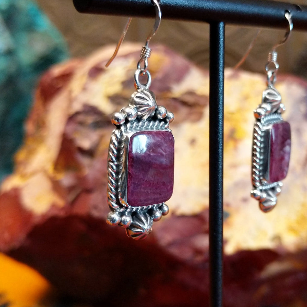 Purple spiny oyster shell set in sterling silver with intricate dot-work and twisted rope accents on the earrings.