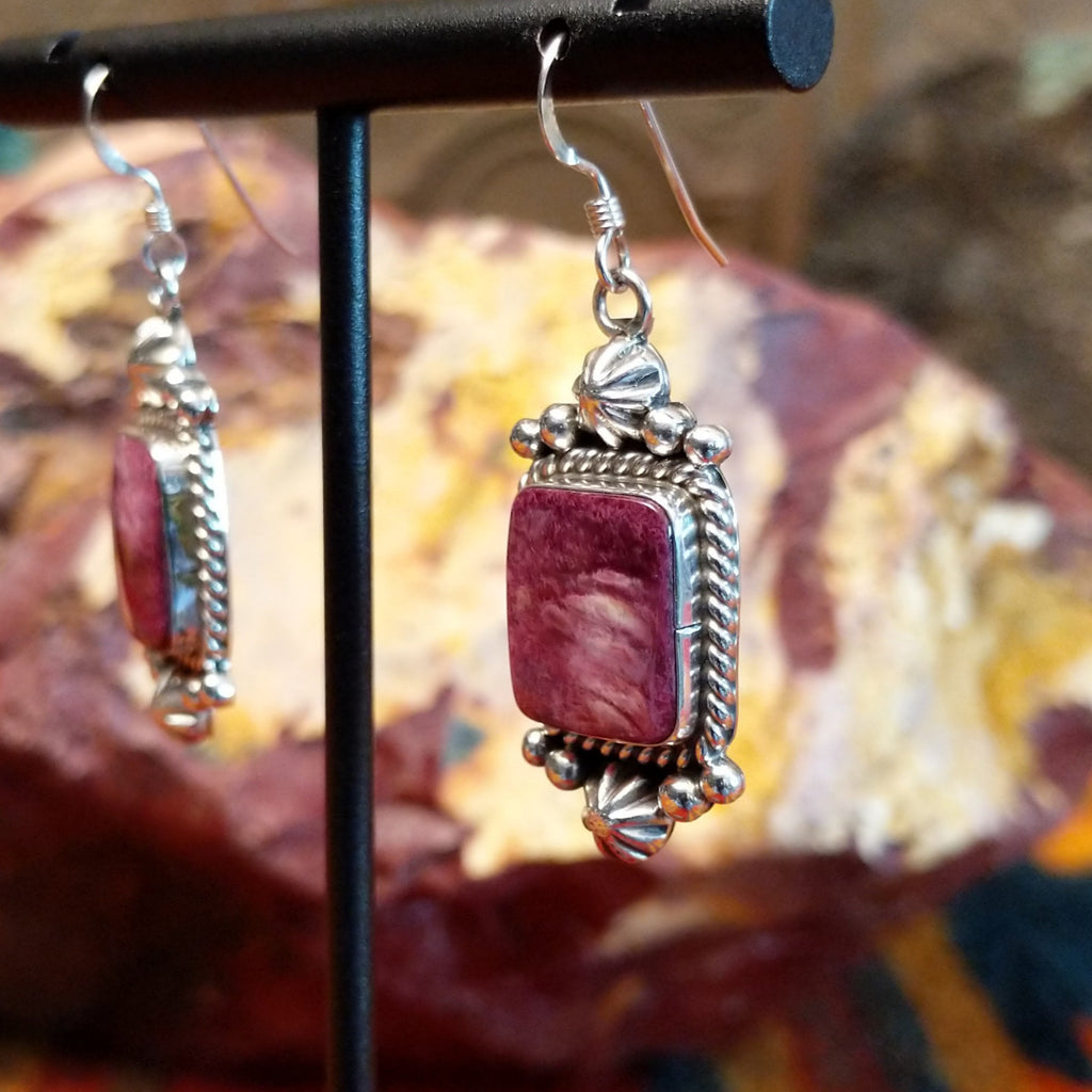 Purple spiny oyster shell set in sterling silver with intricate dot-work and twisted rope accents on the earrings.