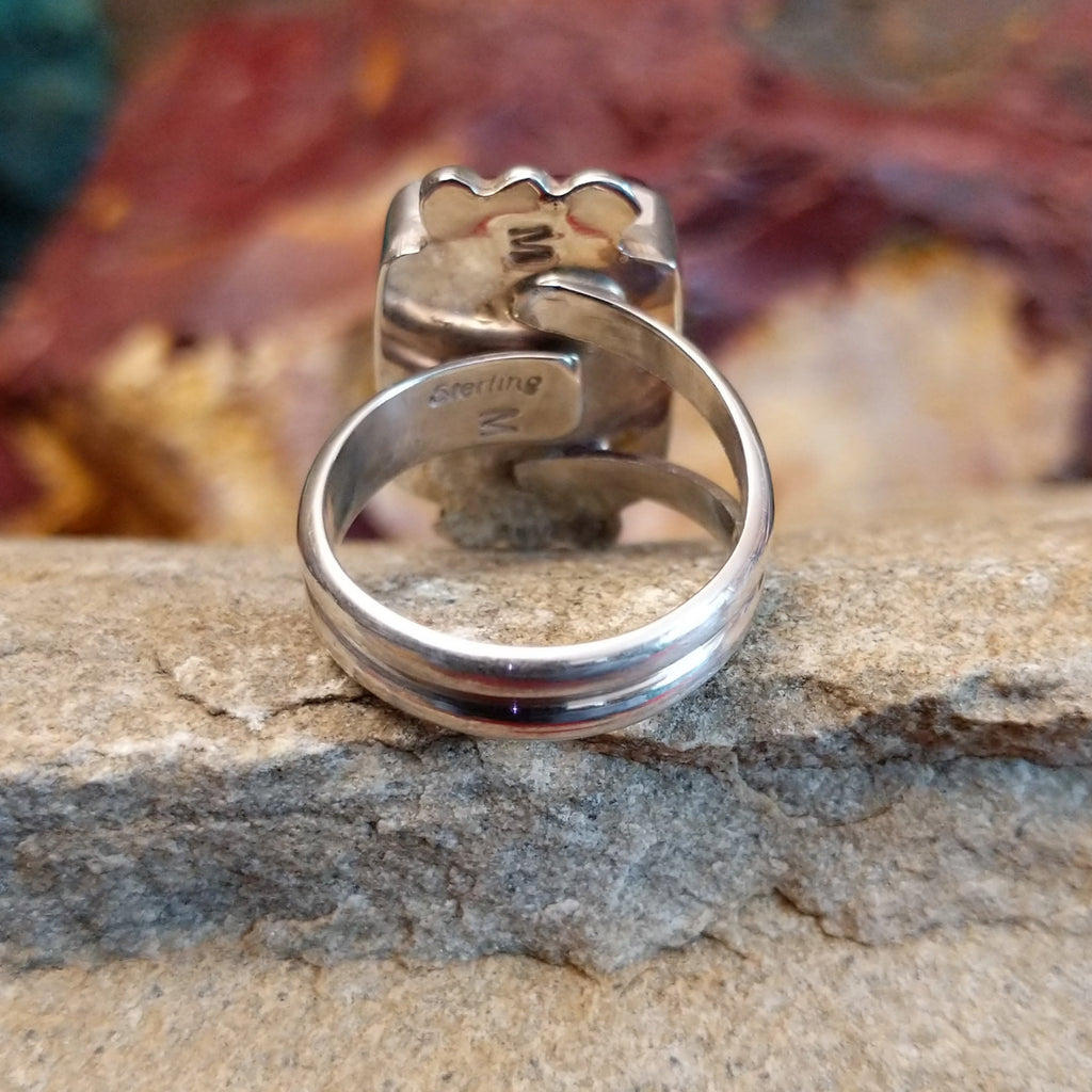 Polished sterling silver layered band of the ring.