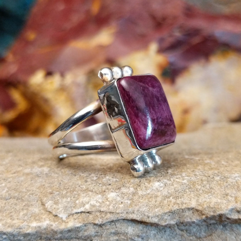 Square purple spiny oyster shell set in a sterling silver bezel with dotted accents.