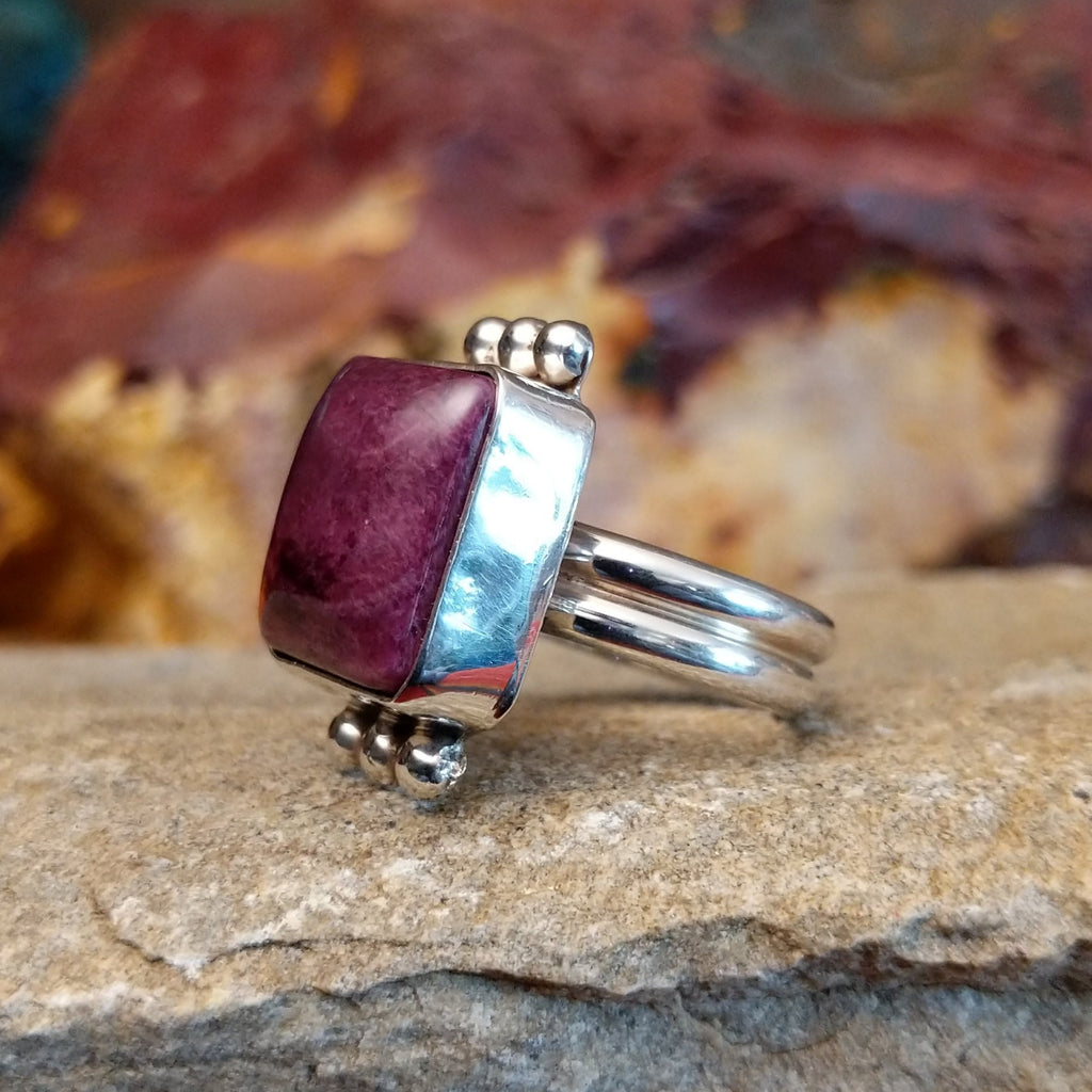 Square purple spiny oyster shell set in a sterling silver bezel with dotted accents.