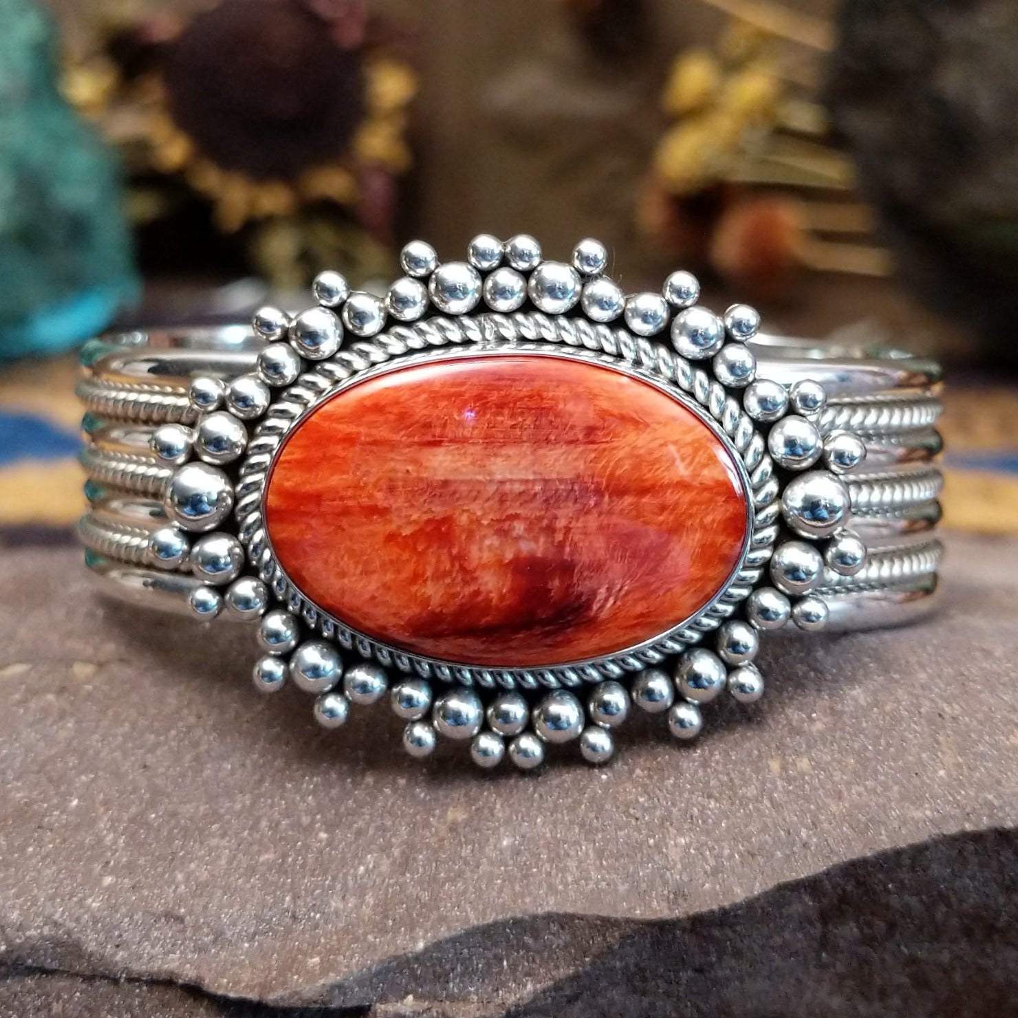 5 row sterling silver cuff featuring spiny oyster shell set in a twisted rope bezel.