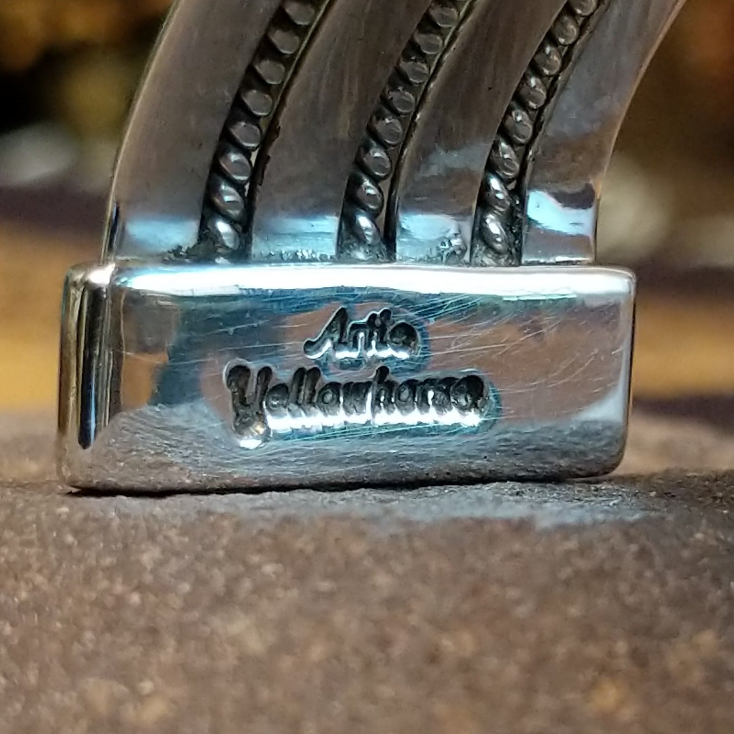 Close up of the artist's stamped signature.