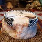 Intricately dotted sterling silver cuff bracelet.