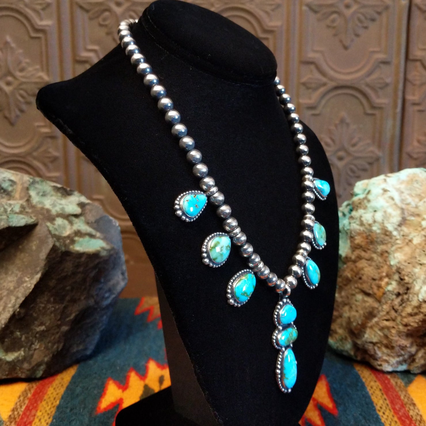 Necklace with Sonoran Mountain turquoise set in bezels along the beaded silver chain. 