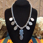 Necklace with Sonoran Mountain turquoise set in bezels along the beaded silver chain. 