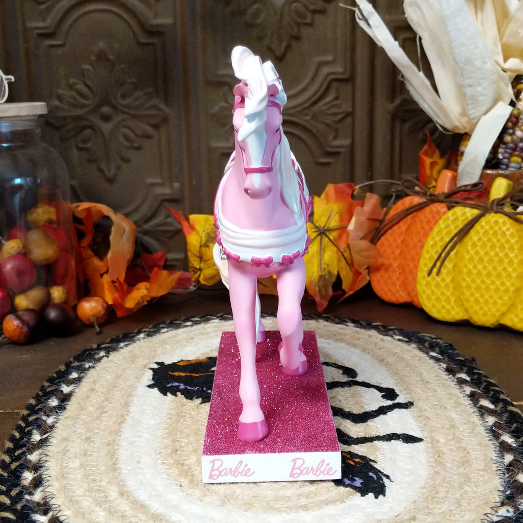 Resin pony painted in various pinks representing the Barbie addition.