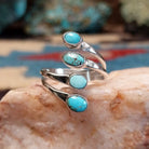 Sterling silver double strand ring with Dry Creek turquoise in oval bezels. 