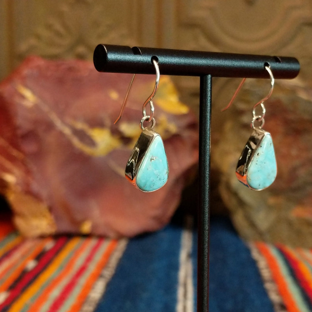 Dry Creek turquoise set tear drop shaped sterling silver bezels.
