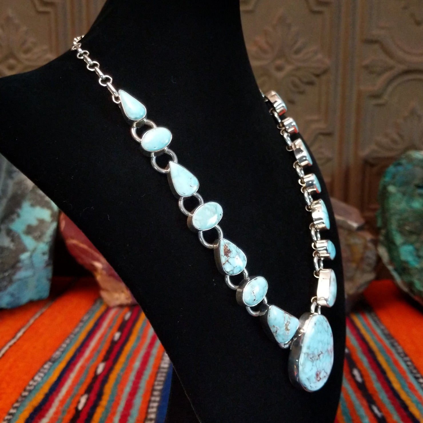 Dry Creek turquoise set in sterling silver bezels that make up the chained necklace and earrings.