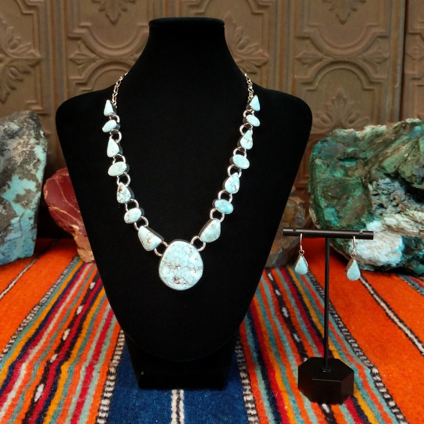 Dry Creek turquoise set in sterling silver bezels that make up the chained necklace and earrings.