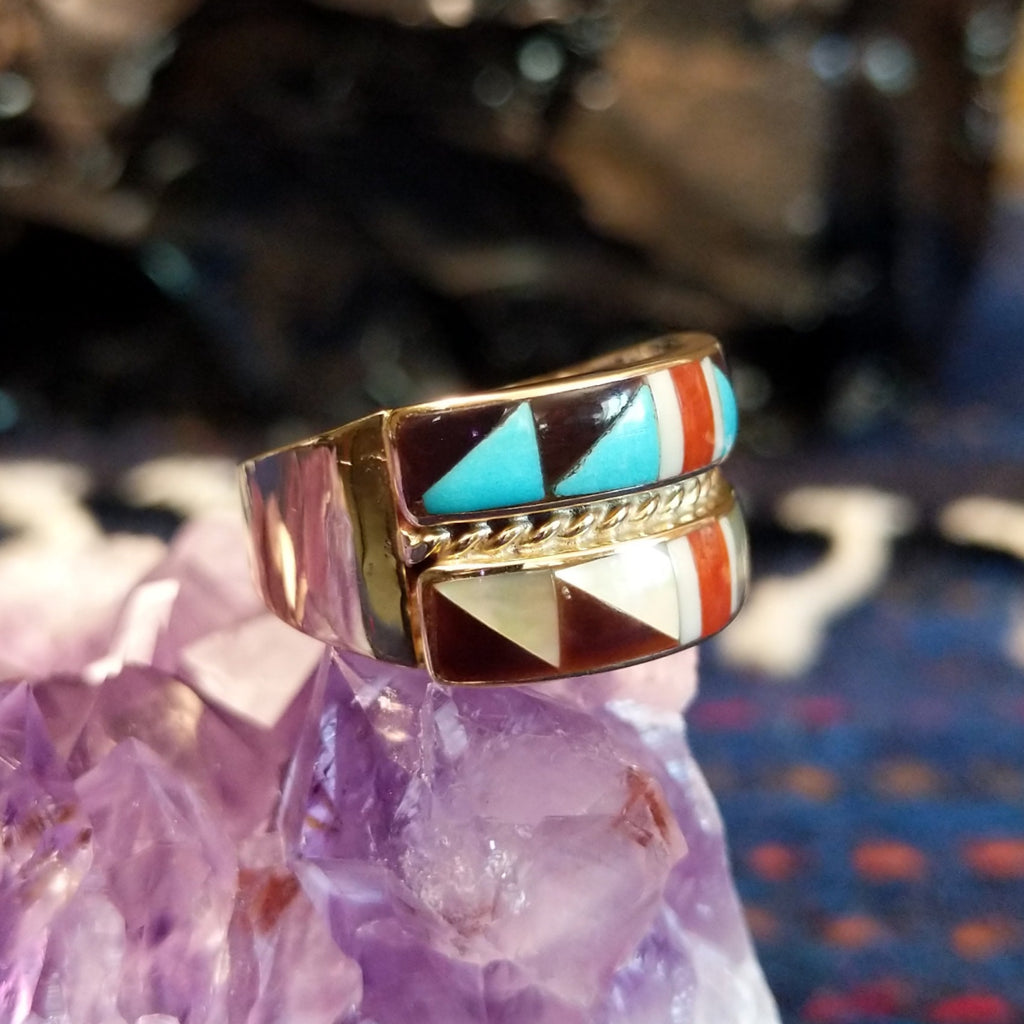 Side profile showing the layered structure and gold band’s polished curve.