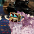 Side profile showing the layered structure and gold band’s polished curve.