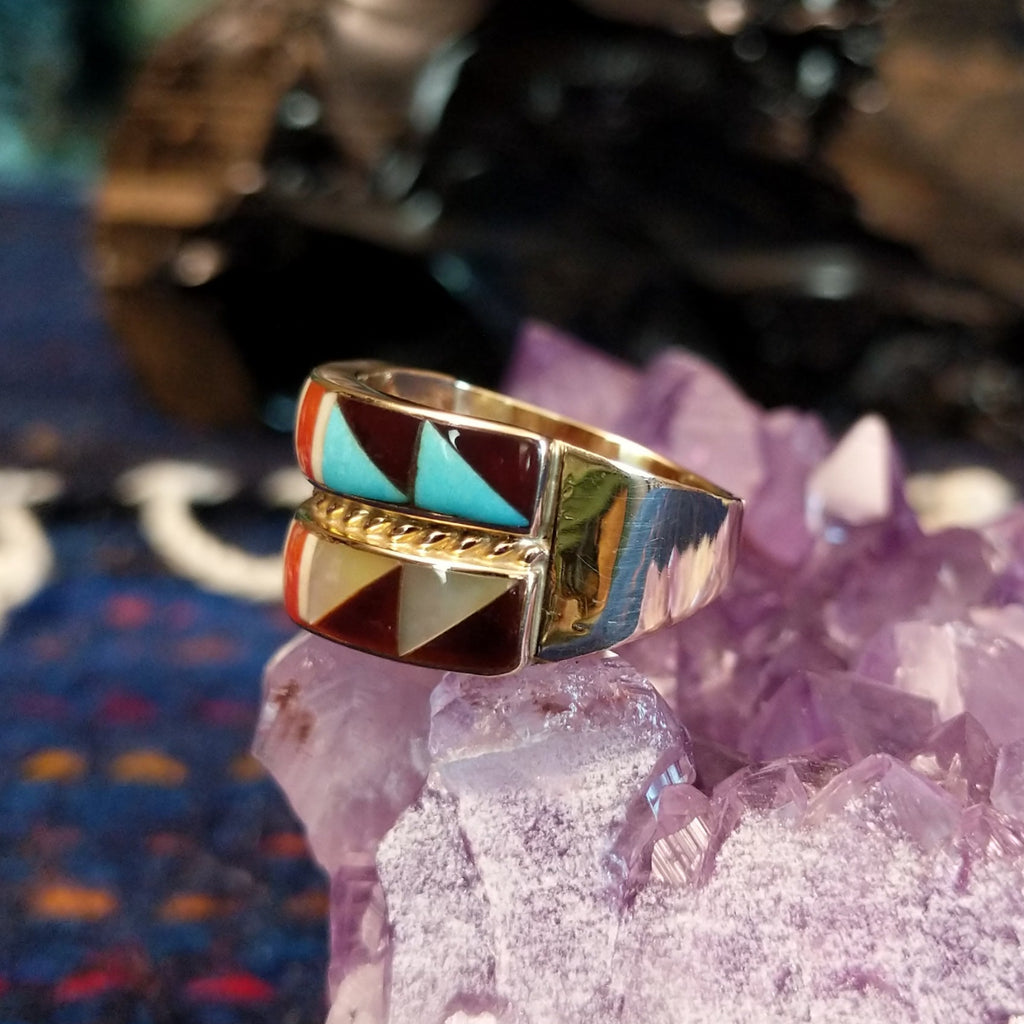 Side profile showing the layered structure and gold band’s polished curve.