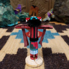 Mini eagle kachina by Rosalind Grey with turquoise face, black fur collar, feathered crest, and outstretched arms.