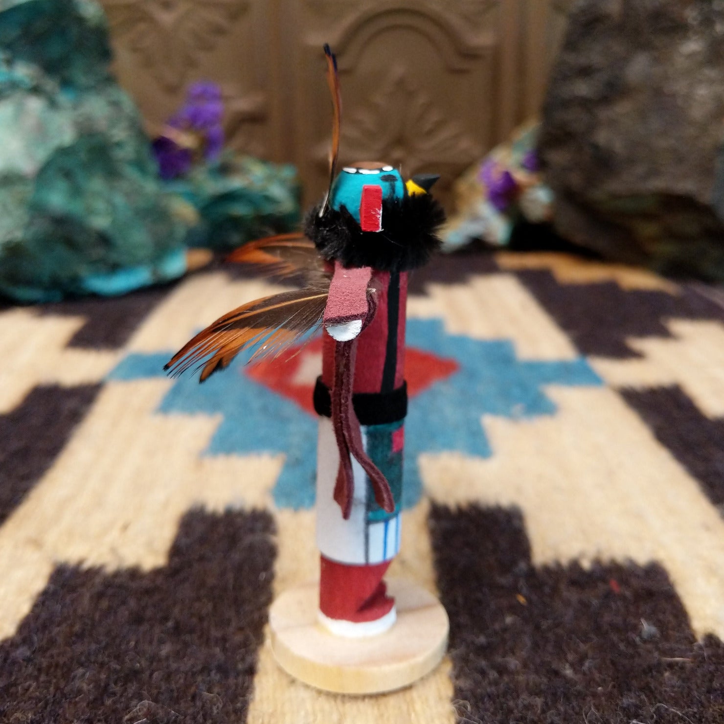 Mini eagle kachina by Rosalind Grey with turquoise face, black fur collar, feathered crest, and outstretched arms.