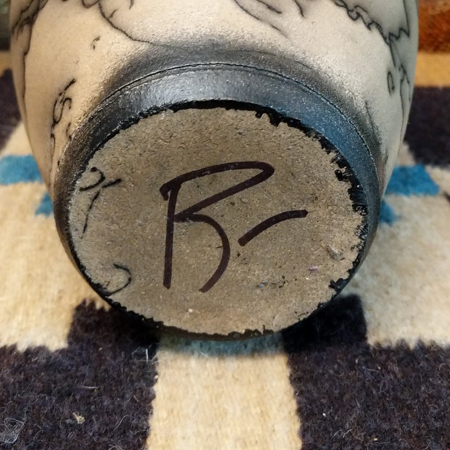 Close-up of the artisan's signature.
