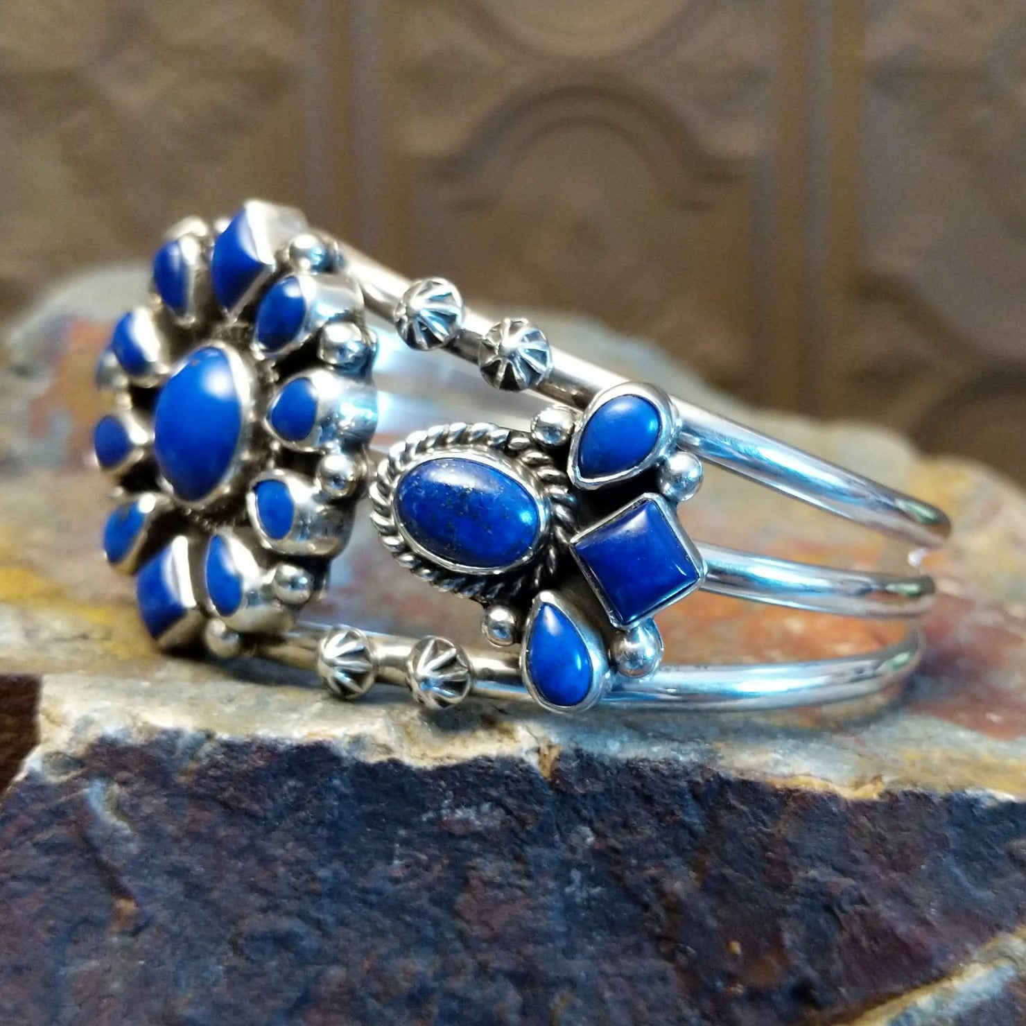 Sterling silver cuff bracelet with lapis set in bezels and twisted rope accents.