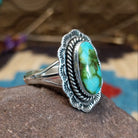 Sterling silver ring with Sonoran gold turquoise set in the oval bezel, framed by twisted rope and stamped setting.
