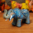 Polymer clay used to create an elephant with colorful geometric and floral designs.