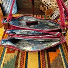Ella Handbag by Liz Soto featuring a compact structured silhouette, textured exterior, dual handles, turn-lock accent, top zip closure, and rectangular Liz Soto logo plaque; interior view.