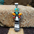 Sterling silver pendant with multiple stones set in various shaped bezels.