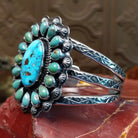 Sterling silver cuff bracelet with Kingman turquoise set in oval bezels, framed by twisted rope and dotted accents.