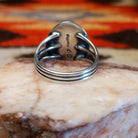 Sterling silver ring with Sleeping Beauty turquoise set in the round bezel, framed by the lined setting.