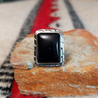 Black onyx silver ring by Scott Skeets with stepped edge details and split band.