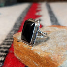 Black onyx silver ring by Scott Skeets with stepped edge details and split band.