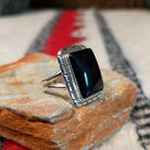 Black onyx silver ring by Scott Skeets with stepped edge details and split band.