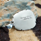 Close-up of the artisan's stamped signature.
