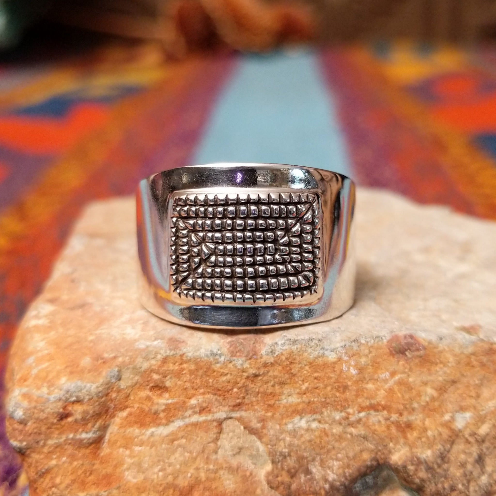 Etched Silver Ring by Raymond Coriz featuring an intricate geometric, maze-like pattern on a broad rectangular face with a polished Sterling Silver band.