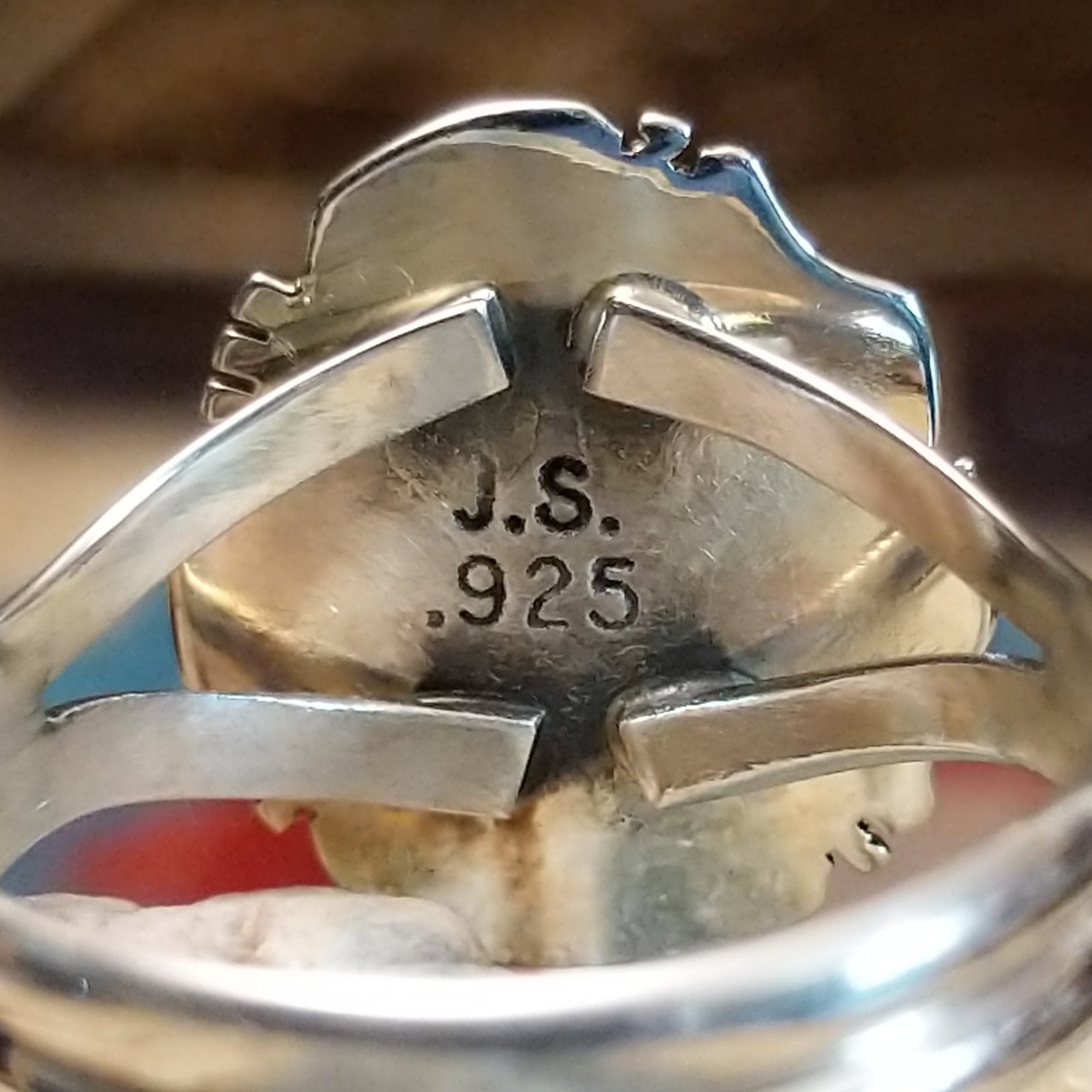 Close-up of the artisan's stamped signature.
