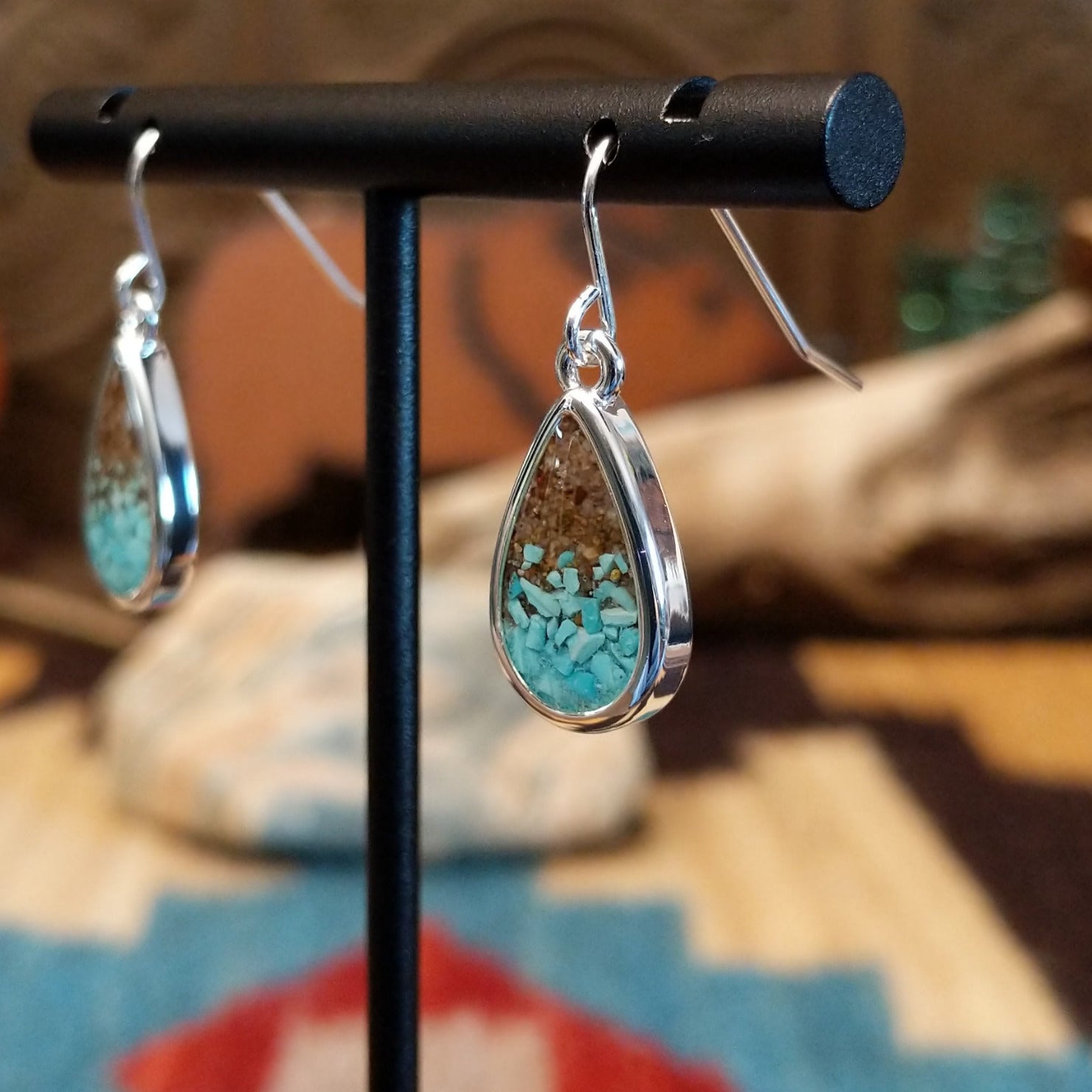 Silver-plated brass earrings with turquoise and San Pedro River sand set in teardrop bezels.