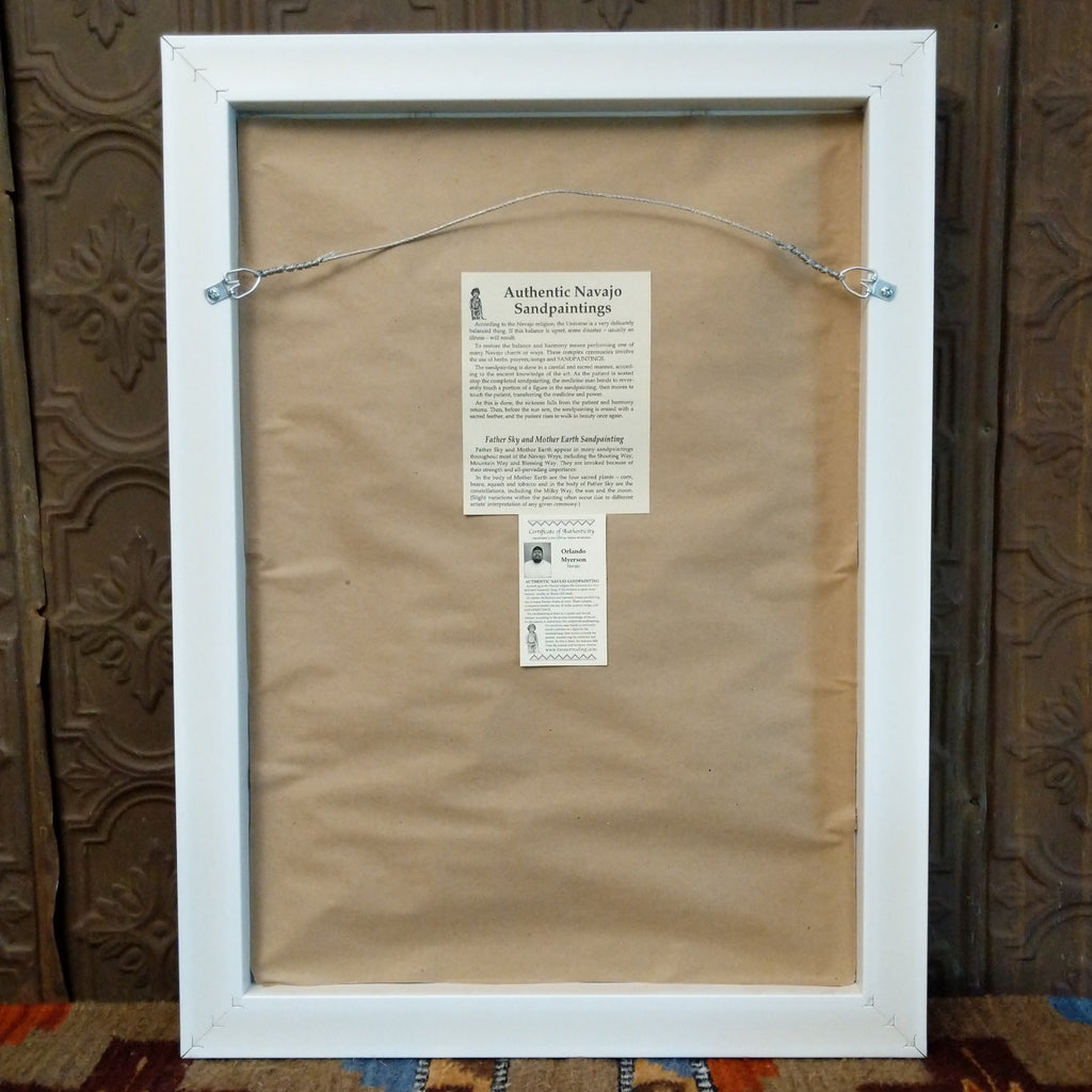 The back features a wire hook and artisan's information.