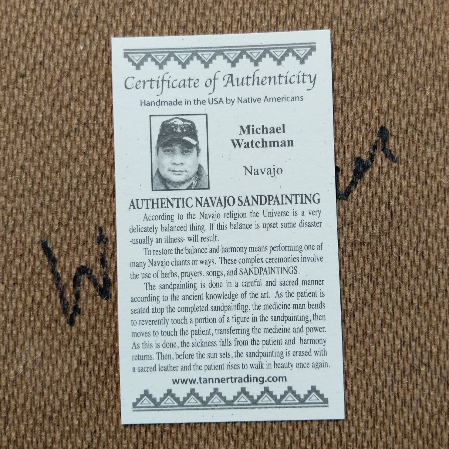 Close up of the Certificate of Authenticity and Artist information. 