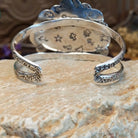 Sterling silver cuff with Sonoran gold turquoise set in bezels forming a floral design, framed by twisted rope and dotted accents.