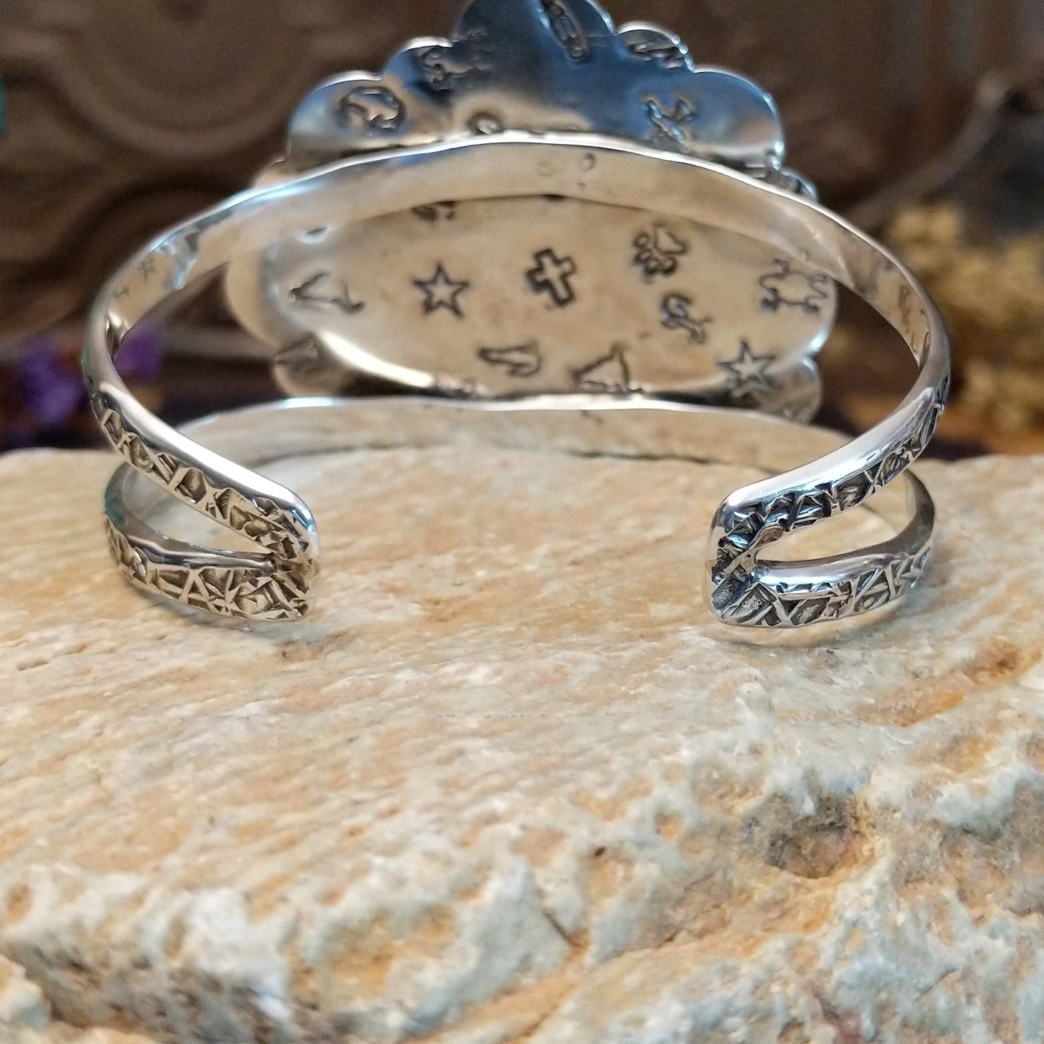 Sterling silver cuff with Sonoran gold turquoise set in bezels forming a floral design, framed by twisted rope and dotted accents.