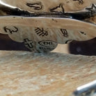 Close-up of the artisans stamped signatures.