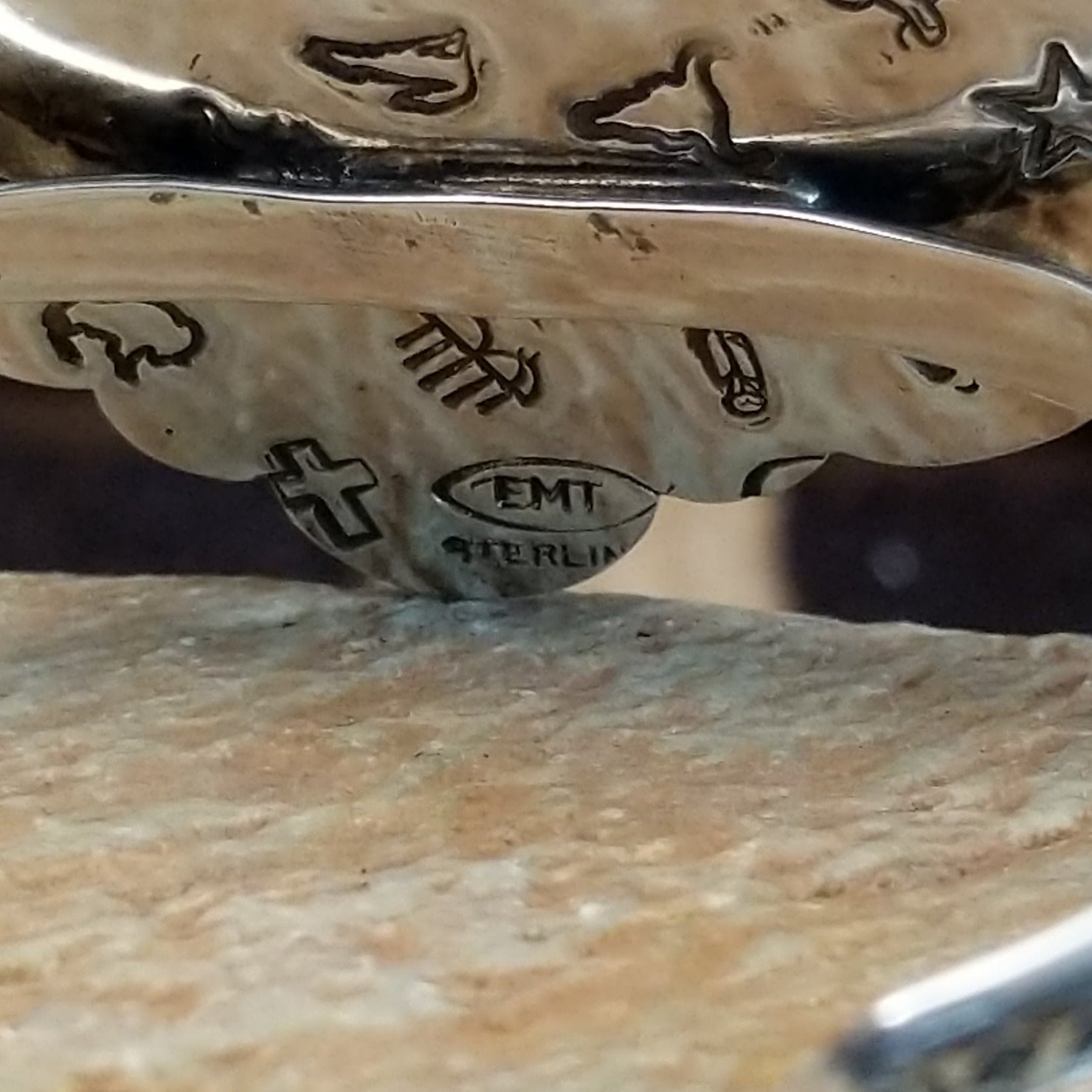 Close-up of the artisans stamped signatures.