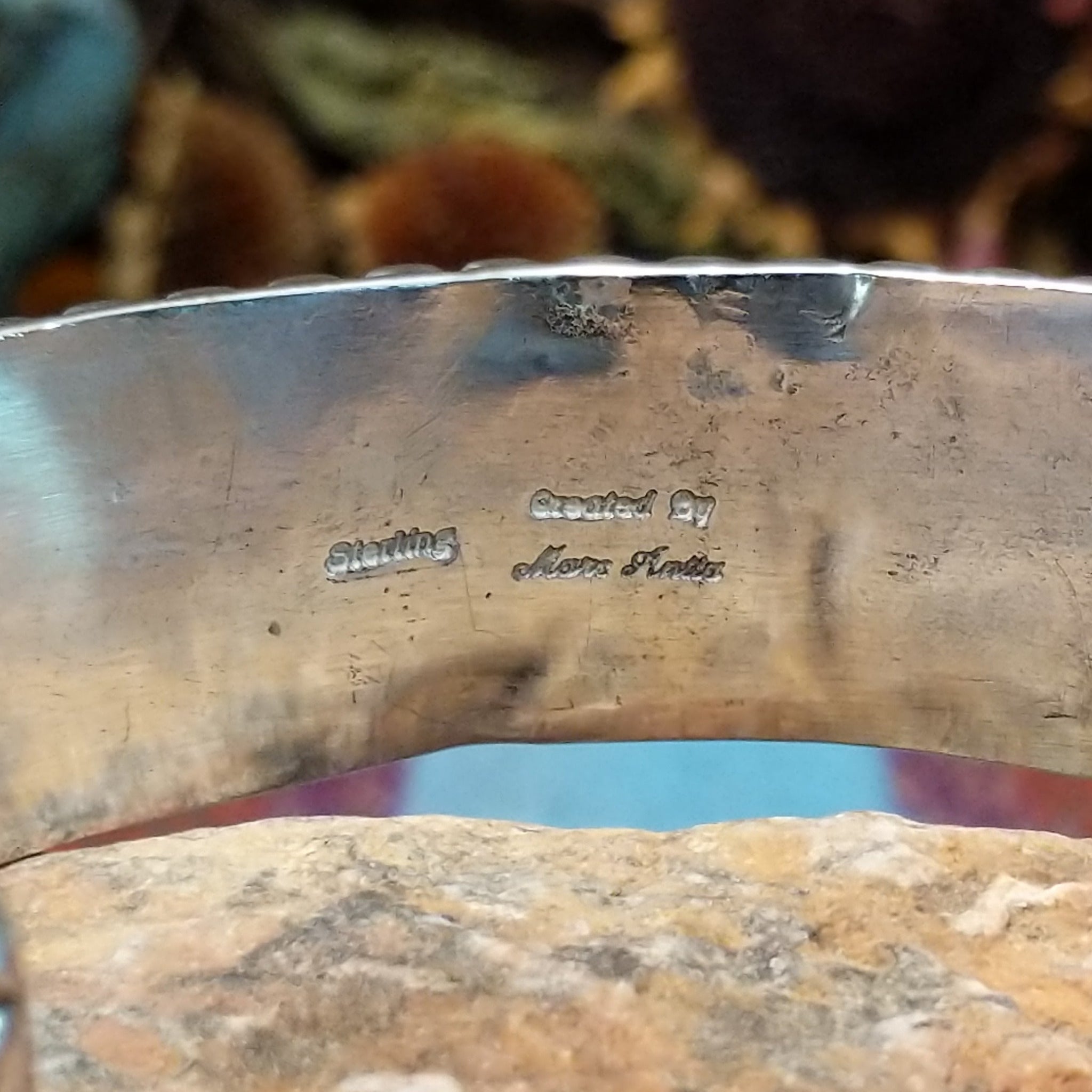 Close up of the artist's stamped signature