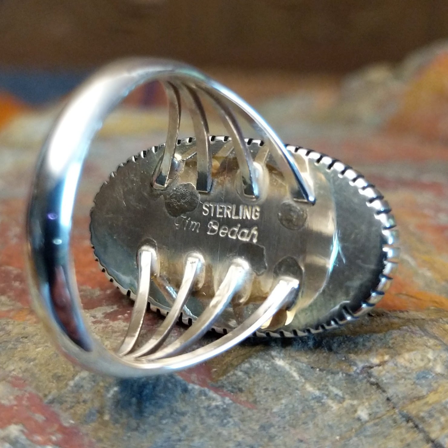 Close-up of the artisan's stamped signature.