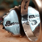 Close-up of the artist's stamped signature. 