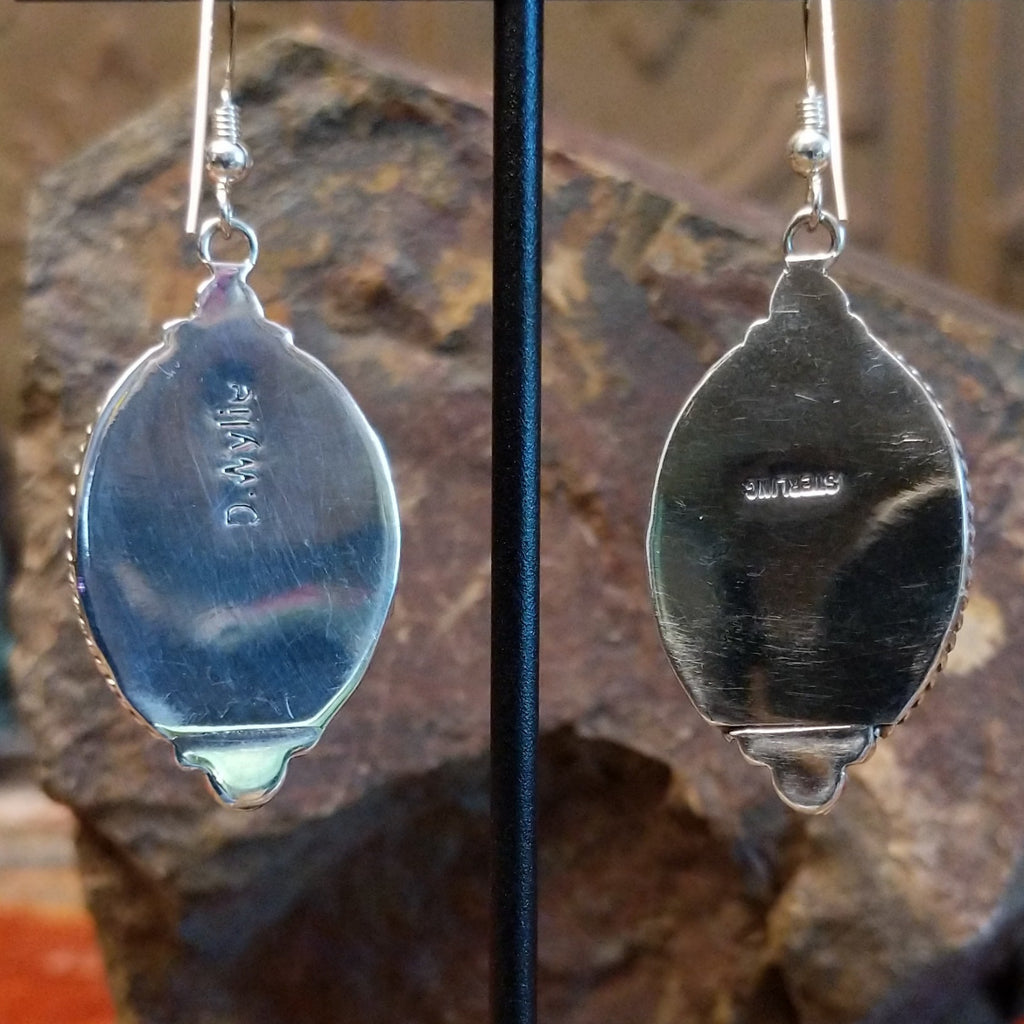 The backing feature the artisan's stamp signature.