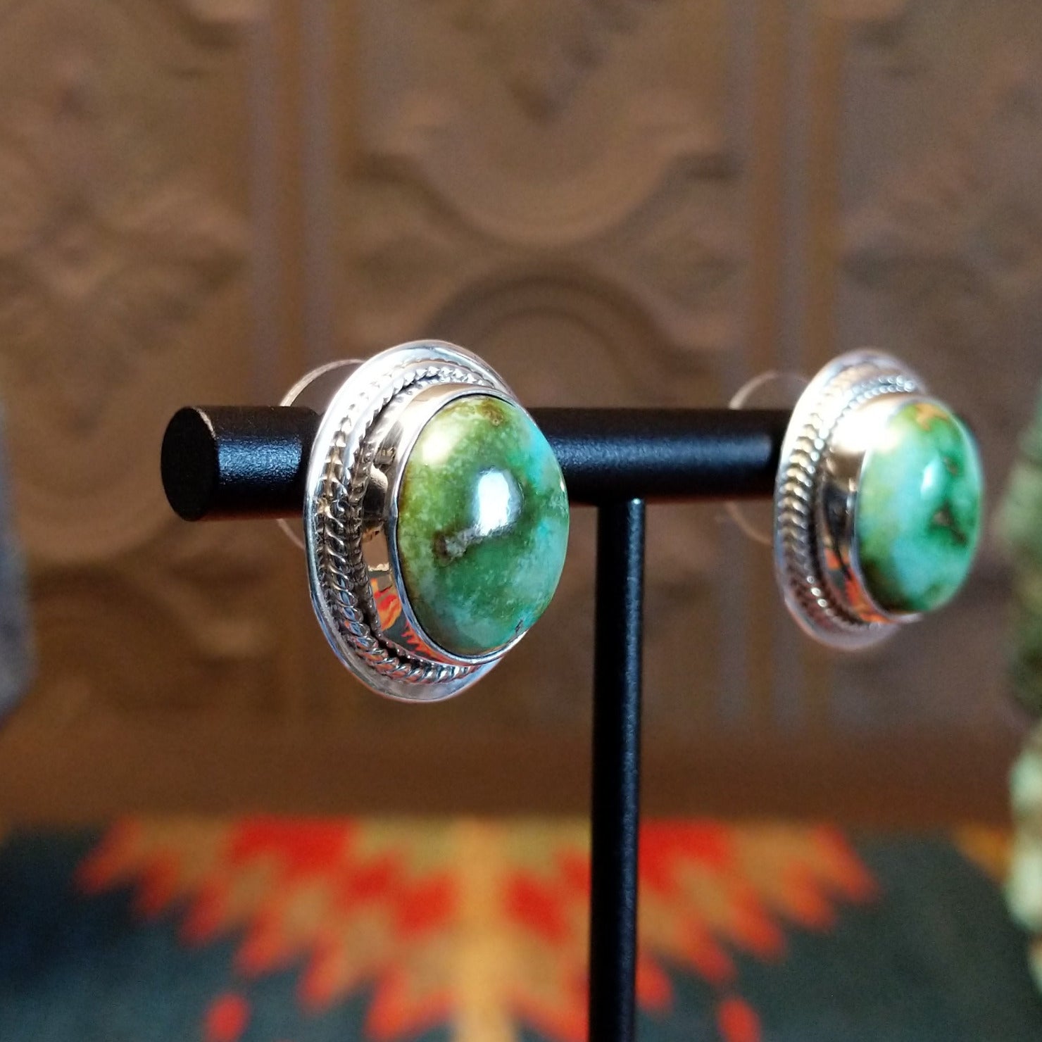 Sterling silver earrings with sonoran gold turquoise set in the bezels, framed by precise silverwork lines.
